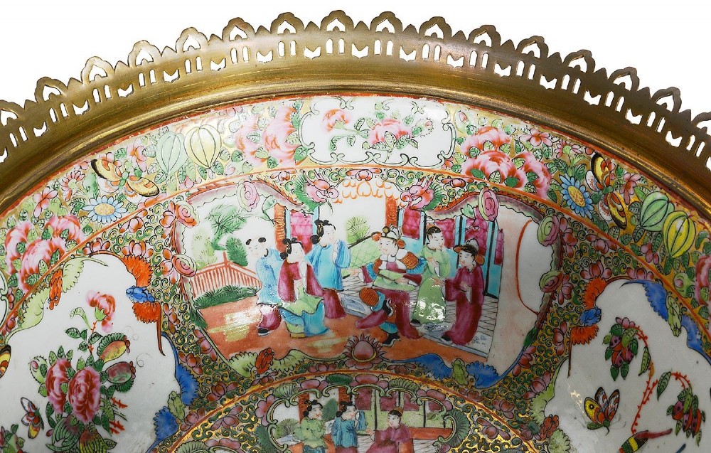A nineteenth-century Cantonese Rose Medallion porcelain bowl held within ornate gilt-bronze ormolu mounts featuring mythical beast handles and a pierced base. View X