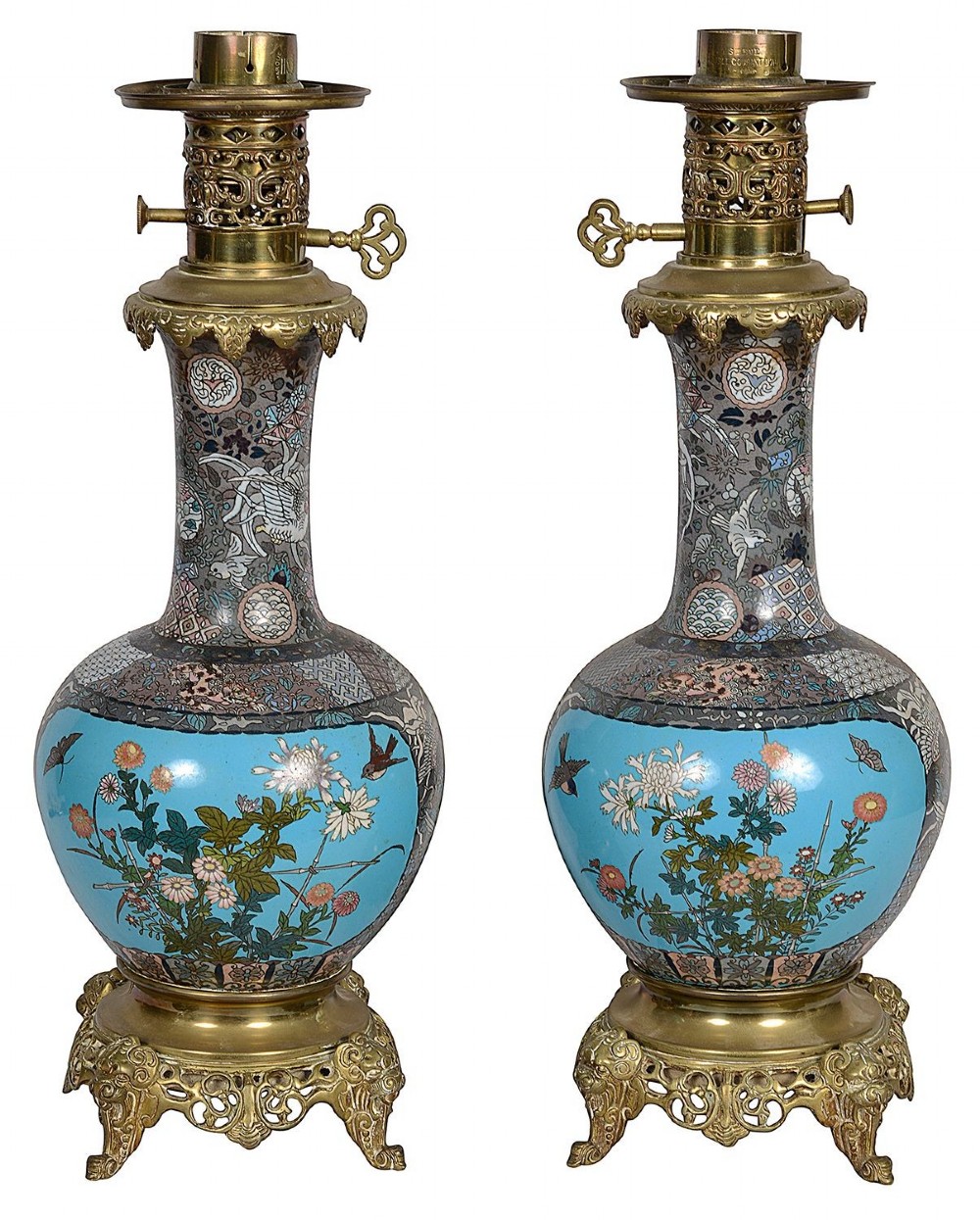 A pair of late nineteenth-century Japanese cloisonne table lamps with turquoise enamel floral bases, brass mounts, and cream pleated lampshades. View II