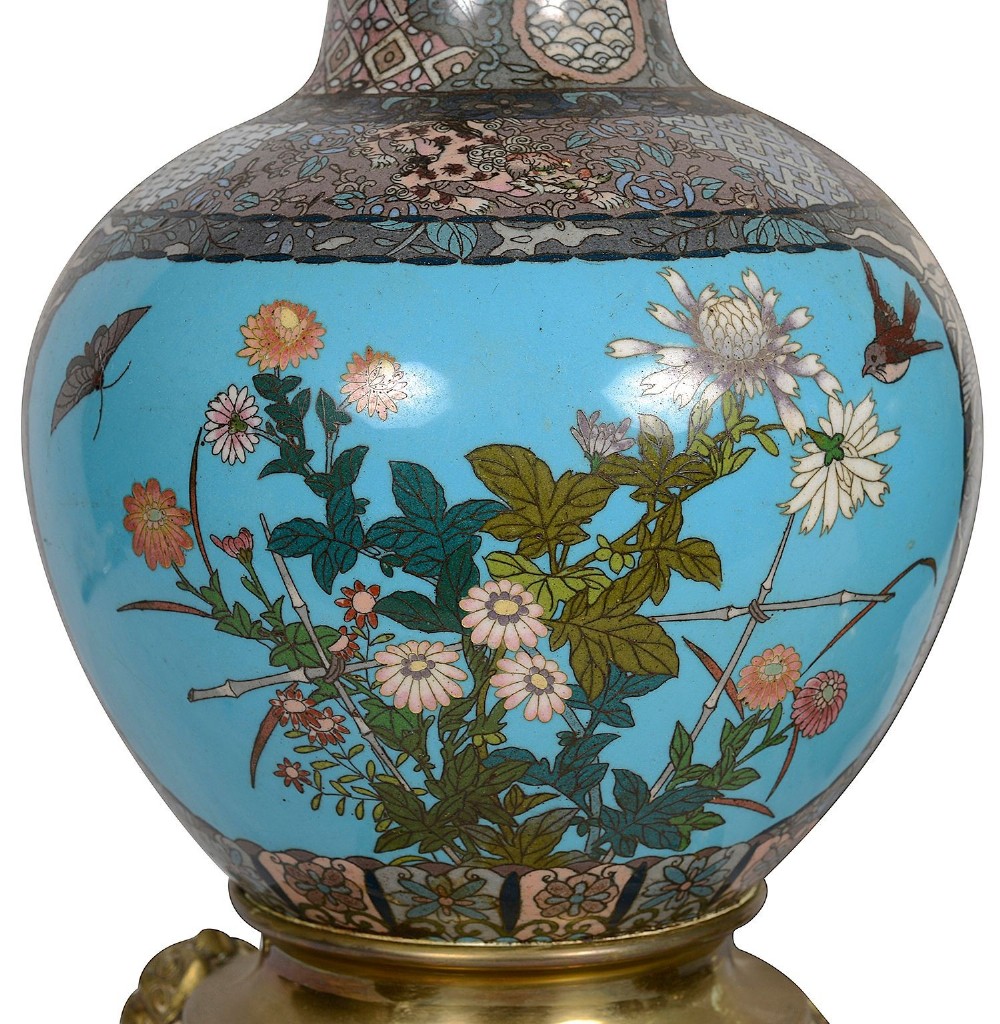 A pair of late nineteenth-century Japanese cloisonne table lamps with turquoise enamel floral bases, brass mounts, and cream pleated lampshades. View III