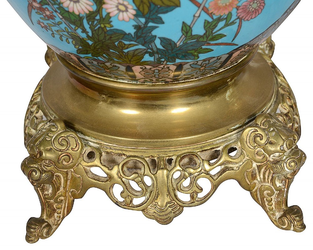 A pair of late nineteenth-century Japanese cloisonne table lamps with turquoise enamel floral bases, brass mounts, and cream pleated lampshades. View VII