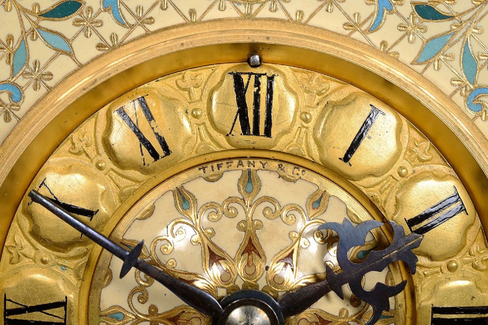 A 19th-century French Louis XVI style gilt bronze mantel clock decorated with multi-coloured enamel scrollwork and topped with twin cherub figures. View III