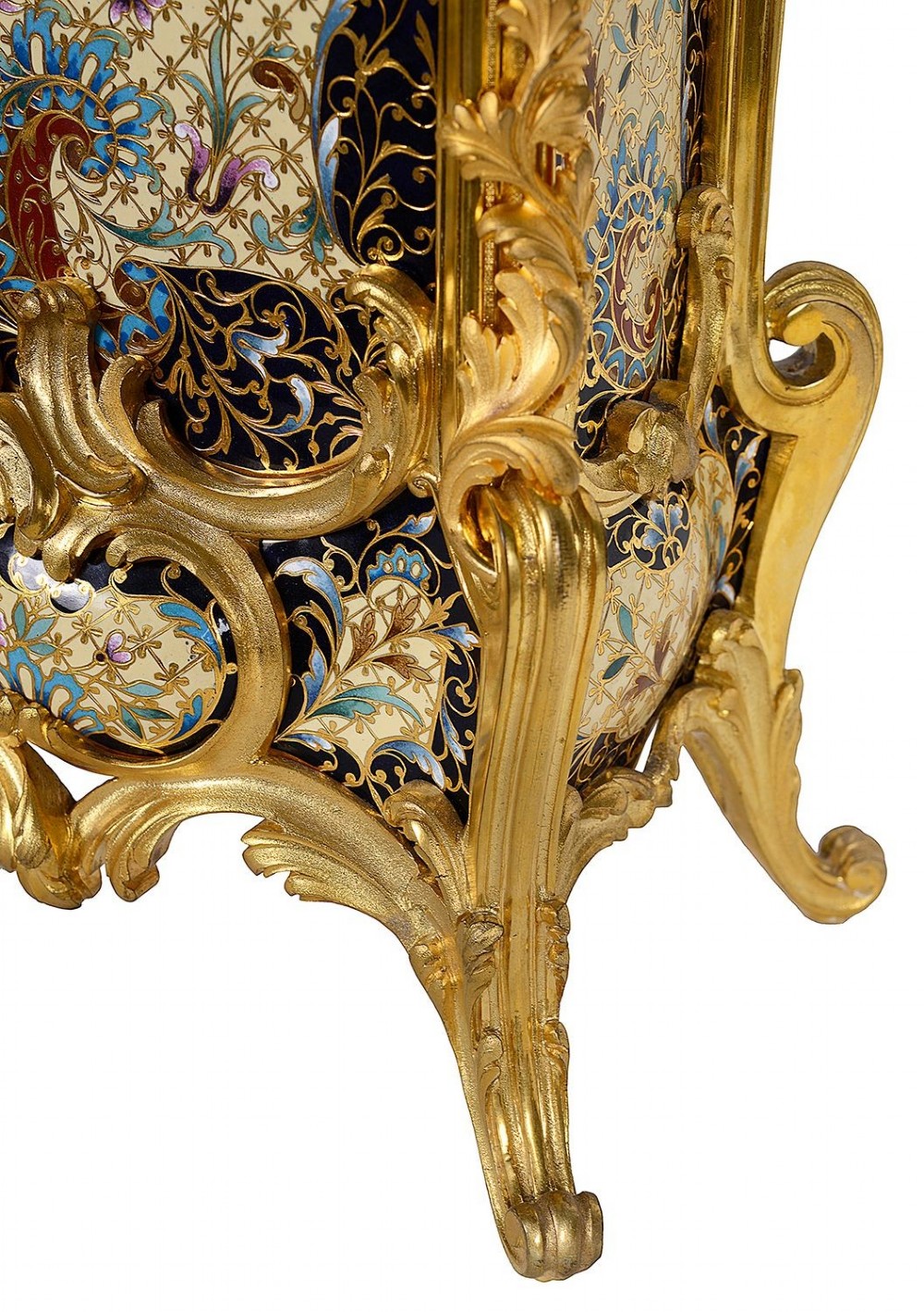 A 19th-century French Louis XVI style gilt bronze mantel clock decorated with multi-coloured enamel scrollwork and topped with twin cherub figures. View V