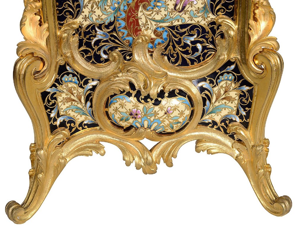 A 19th-century French Louis XVI style gilt bronze mantel clock decorated with multi-coloured enamel scrollwork and topped with twin cherub figures. View VI