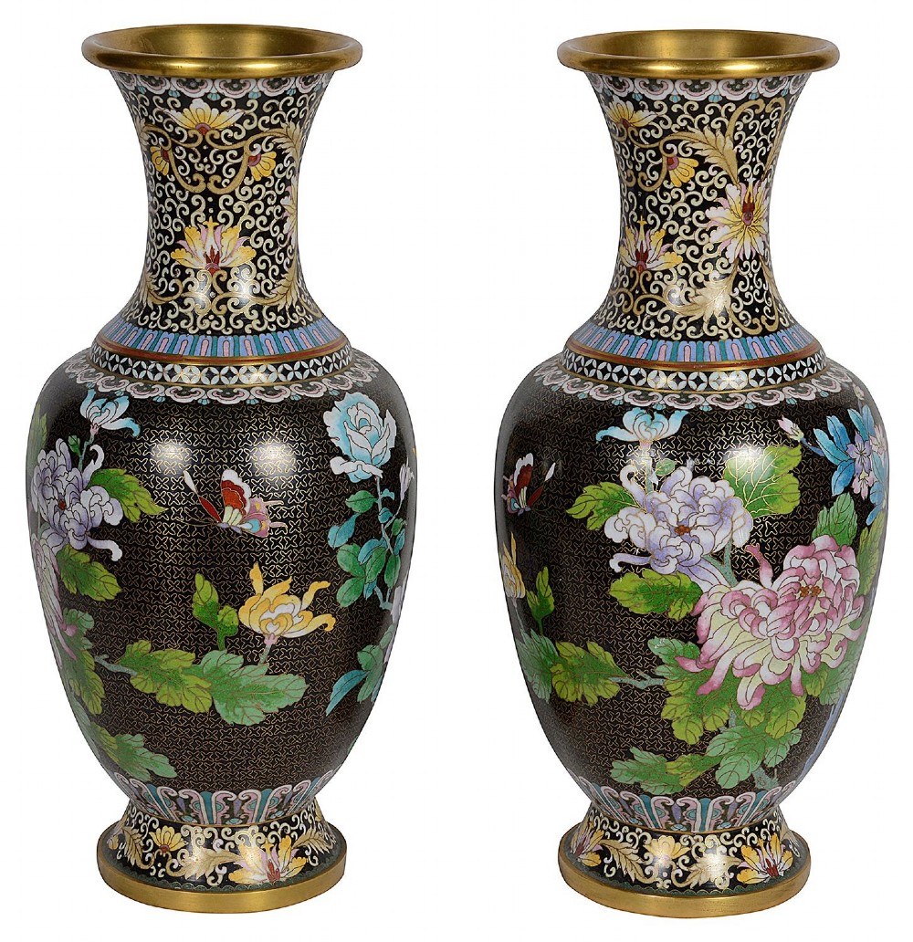 A matching pair of Chinese cloisonne vase table lamps featuring black enamel decorated with colourful floral motifs and butterflies, topped with cream off-white shades. View VII