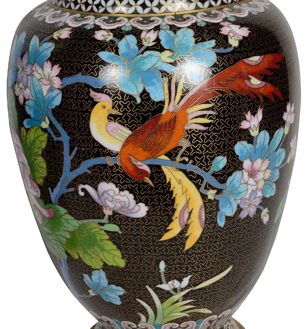 A matching pair of Chinese cloisonne vase table lamps featuring black enamel decorated with colourful floral motifs and butterflies, topped with cream off-white shades. View VIII