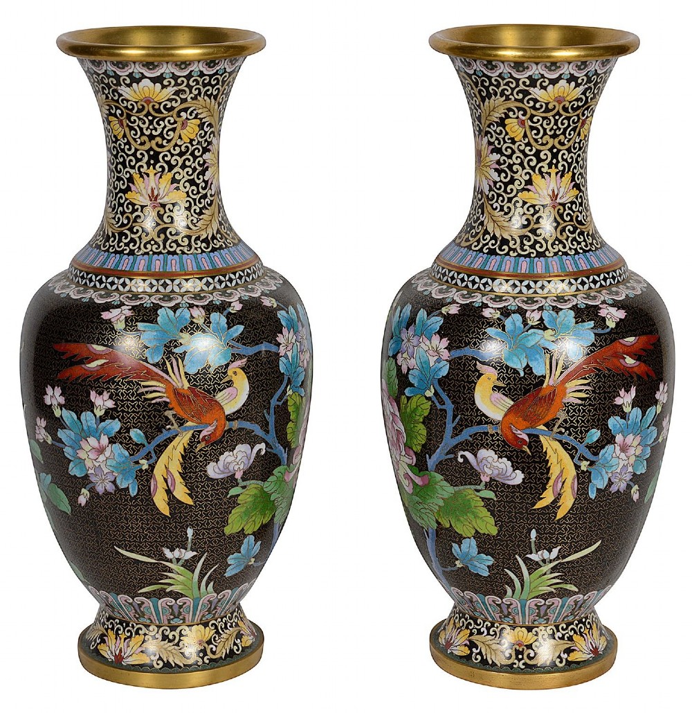 A matching pair of Chinese cloisonne vase table lamps featuring black enamel decorated with colourful floral motifs and butterflies, topped with cream off-white shades. View IX