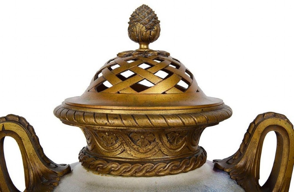 A sang de boeuf red and blue glazed ceramic urn lamp featuring gilt bronze handles and base with a pleated fabric shade. View VII