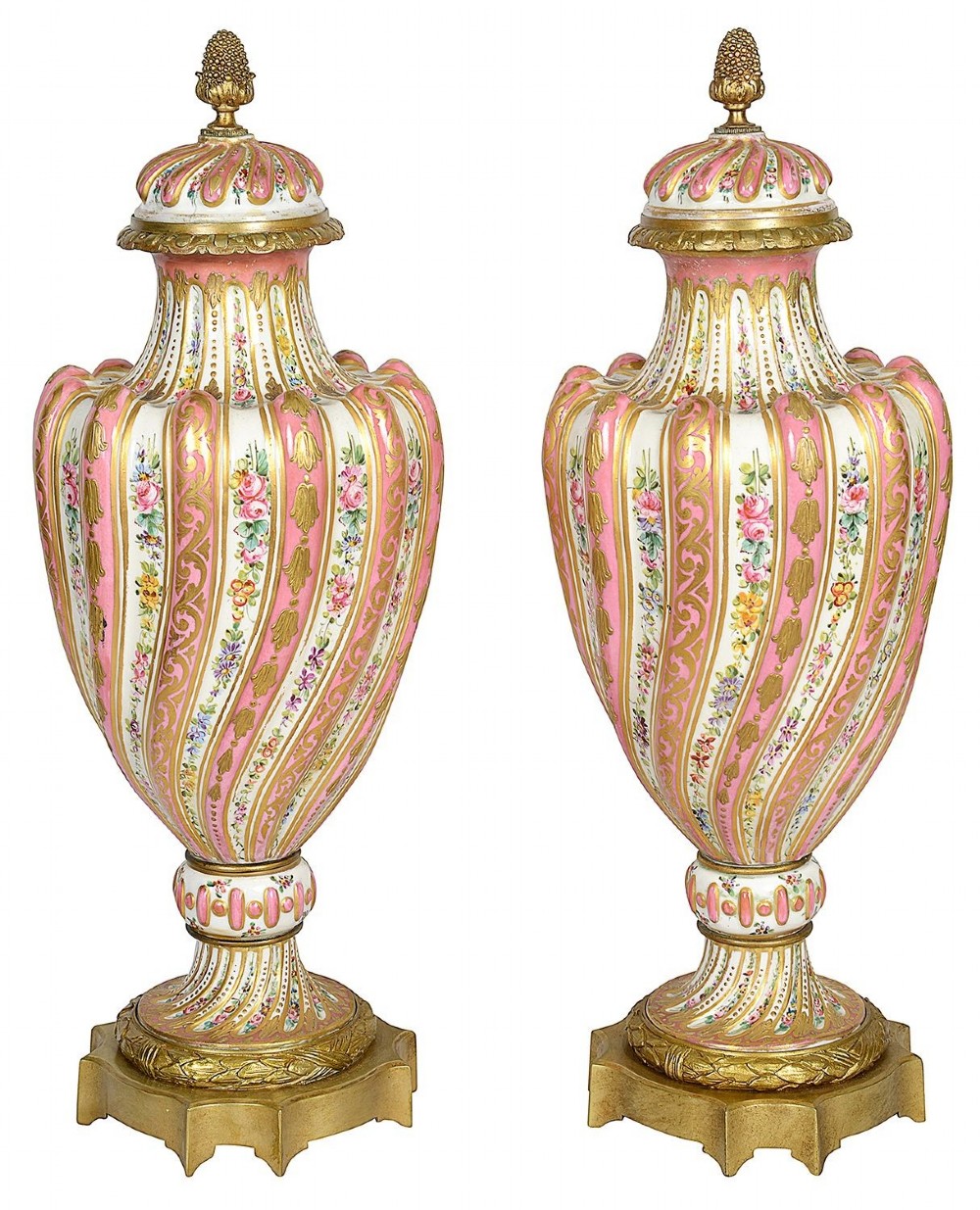A pair of 19th-century French Sevres style pink and white porcelain lidded vases featuring hand-painted floral stripes and gilt decoration on square bases. View V