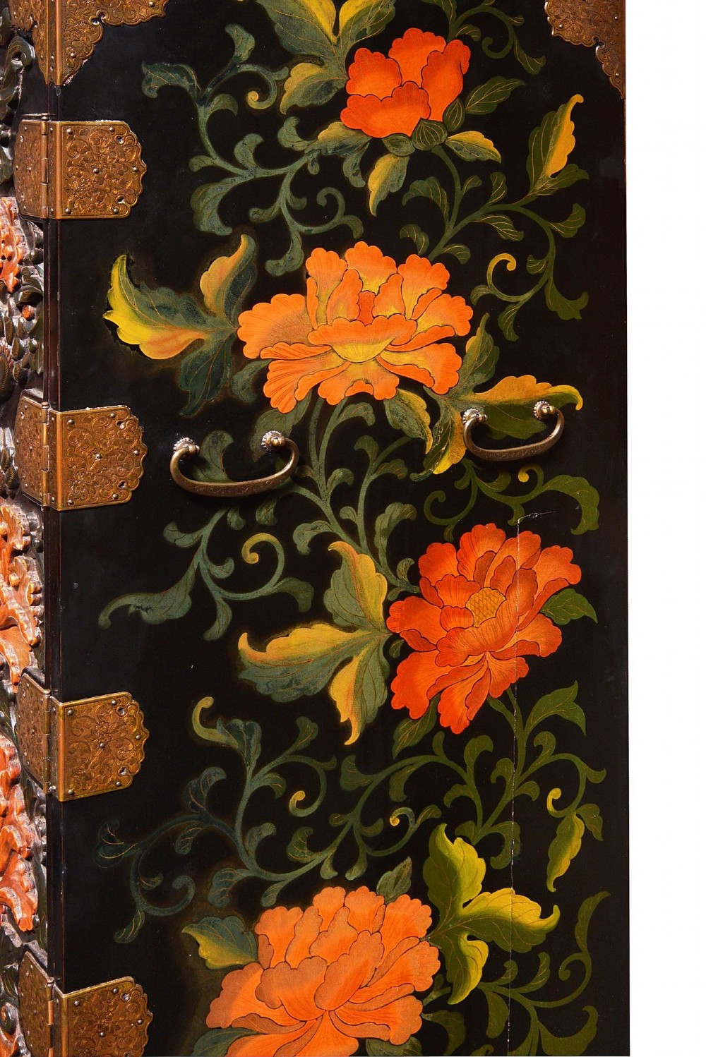 A late nineteenth-century black and polychrome carved lacquer cabinet featuring relief peony and dragon motifs, fitted brass hardware, and a matching stand base. View IV