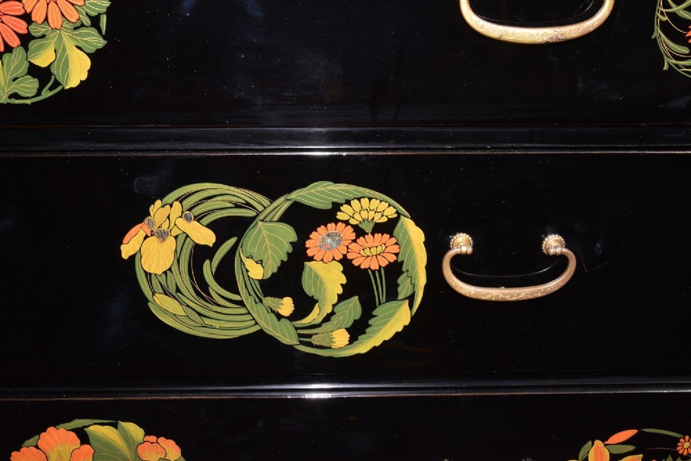 A late nineteenth-century black and polychrome carved lacquer cabinet featuring relief peony and dragon motifs, fitted brass hardware, and a matching stand base. View VII