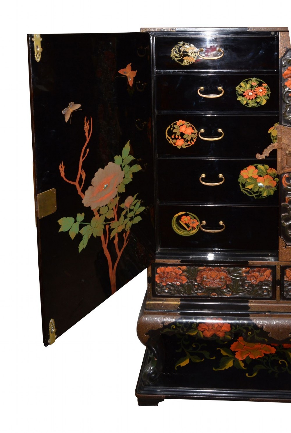 A late nineteenth-century black and polychrome carved lacquer cabinet featuring relief peony and dragon motifs, fitted brass hardware, and a matching stand base. View XI