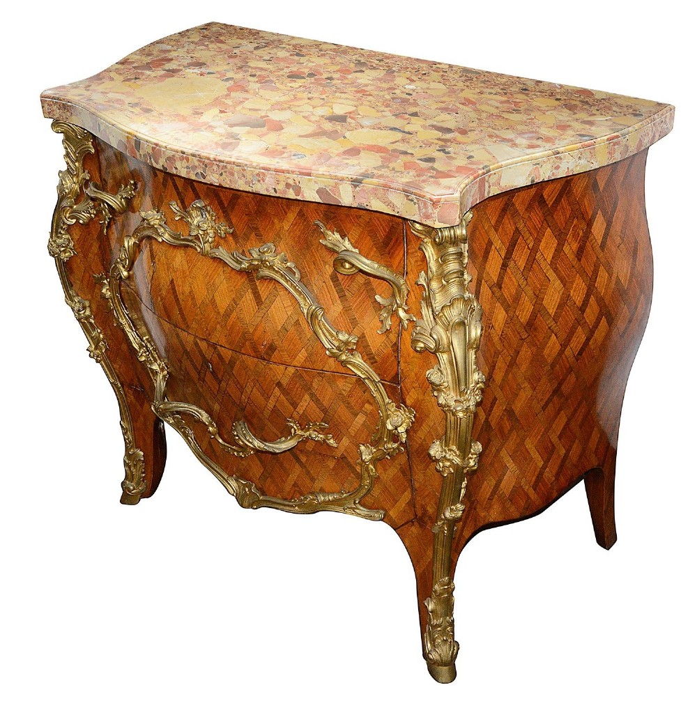 A pair of French eighteenth-century style bombe commodes with geometric wood parquetry, intricate gilt-bronze mounts, and variegated marble tops. View II