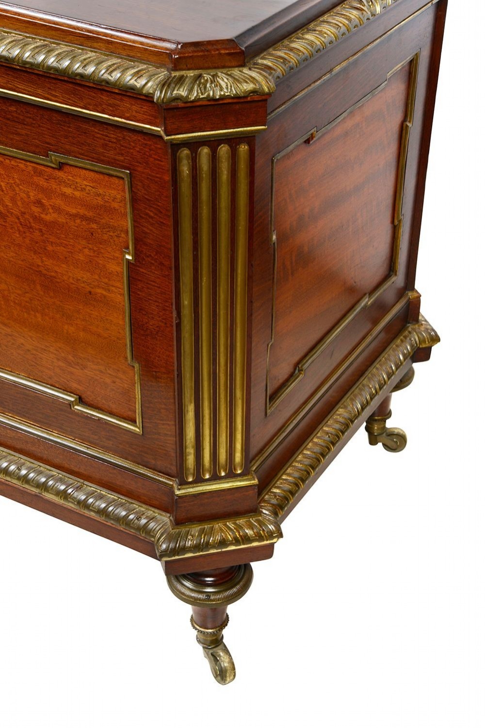 A rectangular French Louis XVI style mahogany cellarette featuring fluted corner columns, ornate brass egg-and-dart moulding, and tapered turned legs with castors. View VI