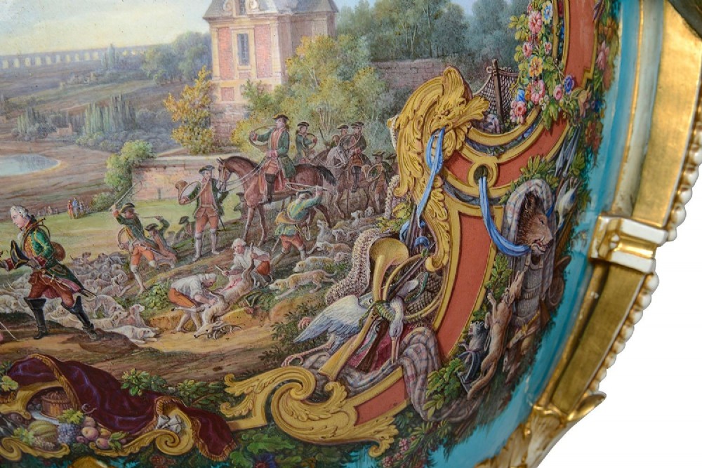 A pair of turquoise blue Sevres-style porcelain urns featuring hand-painted pastoral scenes, gilded scroll handles, and pineapple finials on square metal bases. View VII