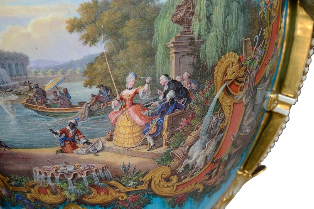 A pair of turquoise blue Sevres-style porcelain urns featuring hand-painted pastoral scenes, gilded scroll handles, and pineapple finials on square metal bases. View VIII