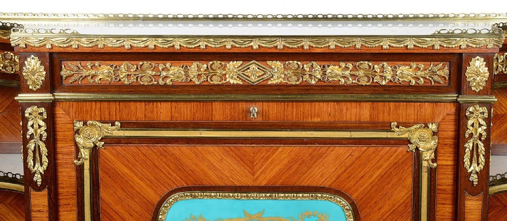 A Louis XVI style secretaire abattant featuring fine wood parquetry, elaborate gilt-bronze ormolu mounts, side display shelves, and a central turquoise porcelain floral plaque. View II