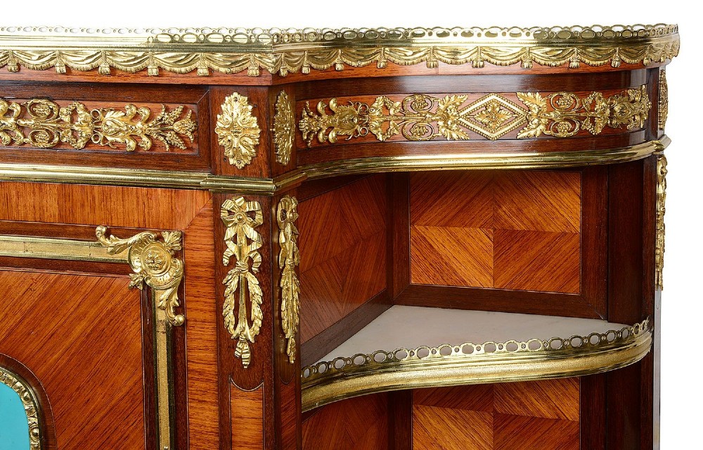 A Louis XVI style secretaire abattant featuring fine wood parquetry, elaborate gilt-bronze ormolu mounts, side display shelves, and a central turquoise porcelain floral plaque. View V
