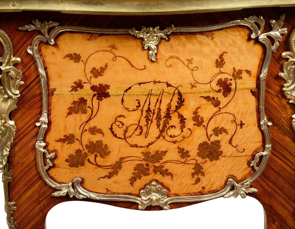 A 19th-century French Rococo Revival marquetry bureau de dame featuring floral timber inlays, serpentine edges, leather inset top, and gilt-bronze mounts on cabriole legs. View VI