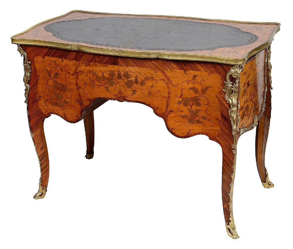 A 19th-century French Rococo Revival marquetry bureau de dame featuring floral timber inlays, serpentine edges, leather inset top, and gilt-bronze mounts on cabriole legs. View VII