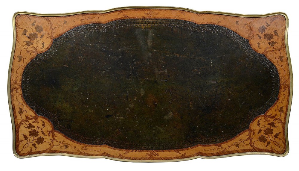A 19th-century French Rococo Revival marquetry bureau de dame featuring floral timber inlays, serpentine edges, leather inset top, and gilt-bronze mounts on cabriole legs. View VIII