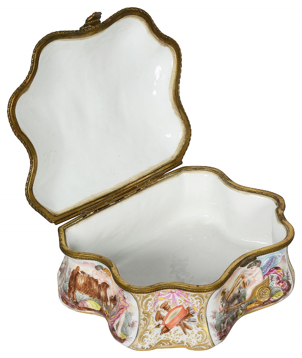 A late nineteenth-century serpentine-shaped hand-painted porcelain jewellery casket featuring relief-moulded classical figures and gilt brass mounts. View IV