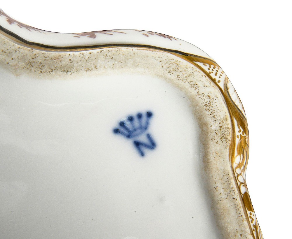 A late nineteenth-century serpentine-shaped hand-painted porcelain jewellery casket featuring relief-moulded classical figures and gilt brass mounts. View IX