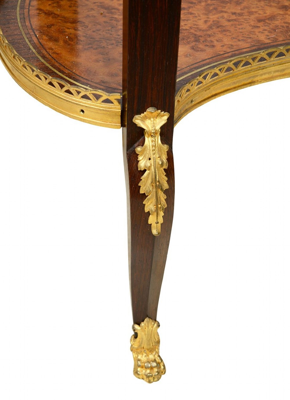 A Louis XVI style kidney-shaped two-tier side table featuring burr walnut veneer, a pierced brass gallery, and gilt-bronze mounts. View VII