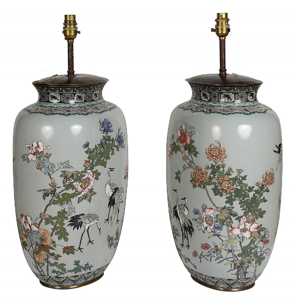 A pair of Japanese cloisonne enamel vase table lamps decorated with cranes and floral motifs on a light blue ground with cream pleated shades. View III