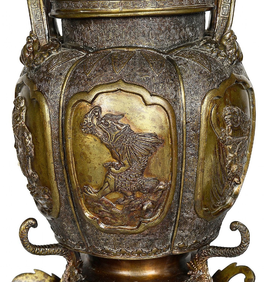 A pair of ornate antique Japanese Meiji period bronze lidded censers featuring dragon bases, relief panels, and shishi lion finials. View IV