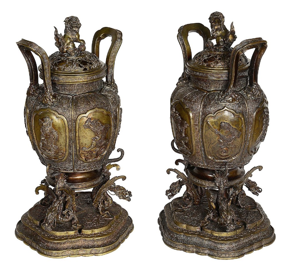 A pair of ornate antique Japanese Meiji period bronze lidded censers featuring dragon bases, relief panels, and shishi lion finials. View VII