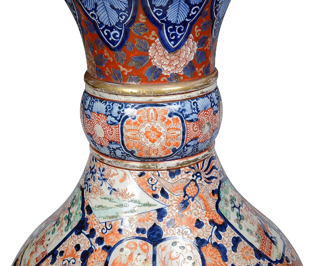 A tall Japanese Imari porcelain floor vase featuring a flared wavy rim, decorated with cobalt blue and orange enamel floral panels. View II