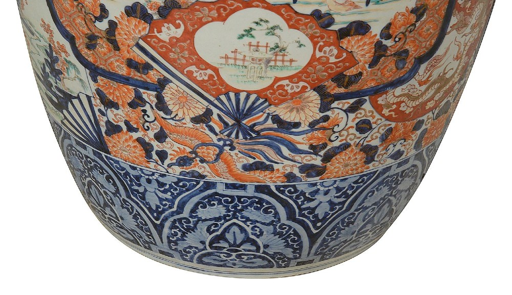 A tall Japanese Imari porcelain floor vase featuring a flared wavy rim, decorated with cobalt blue and orange enamel floral panels. View IV