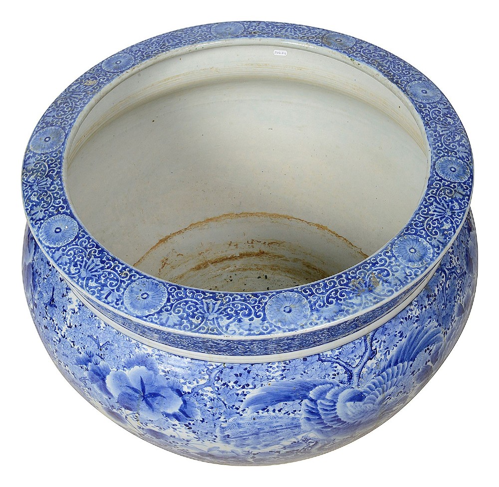 A large round Japanese blue and white porcelain jardiniere featuring intricate hand-painted floral patterns and bird motifs. View II