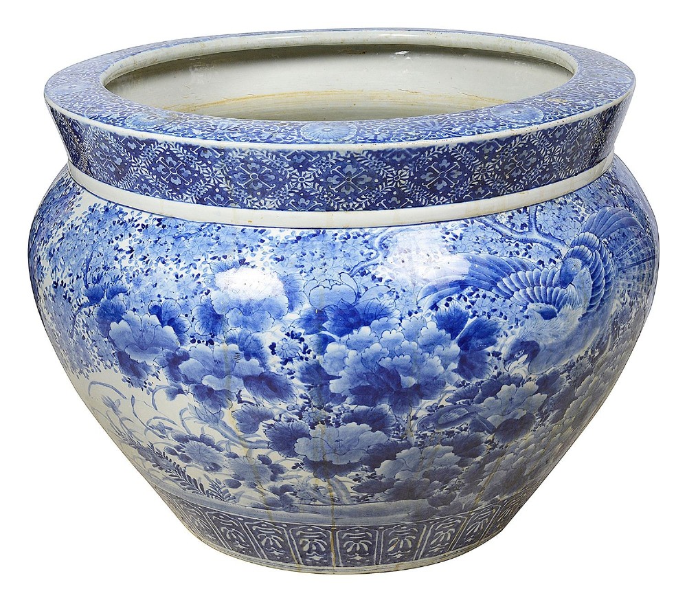 A large round Japanese blue and white porcelain jardiniere featuring intricate hand-painted floral patterns and bird motifs. View IV