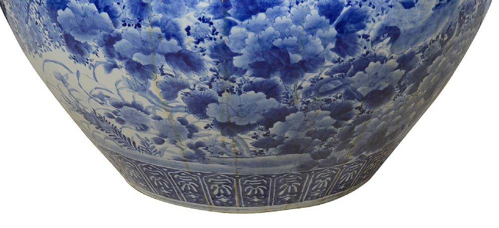 A large round Japanese blue and white porcelain jardiniere featuring intricate hand-painted floral patterns and bird motifs. View V