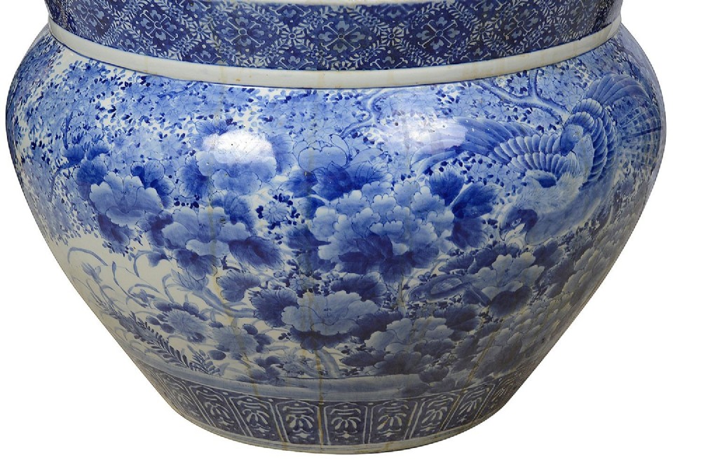 A large round Japanese blue and white porcelain jardiniere featuring intricate hand-painted floral patterns and bird motifs. View VI