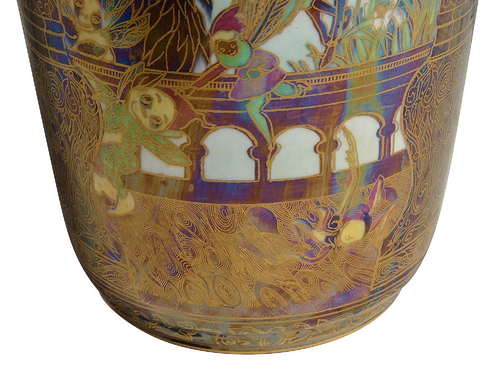 A tall Art Deco porcelain vase featuring iridescent lustre glazing, fairy tale illustrations, and intricate gold architectural borders. View V