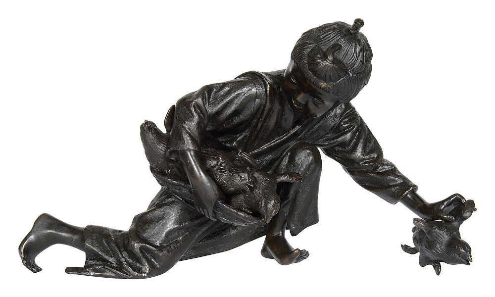 Japanese bronze girl, gathering up chickens. circa 1890.