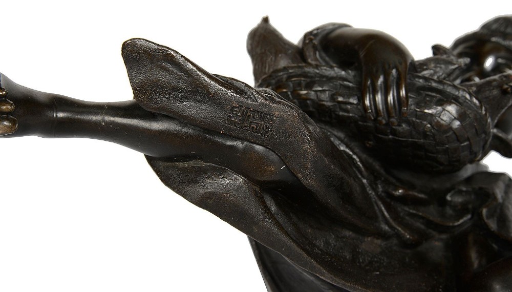 A dark brown patinated Japanese bronze sculpture depicting a crouching girl in traditional robes gathering chickens, dating to the late nineteenth century. View VIII