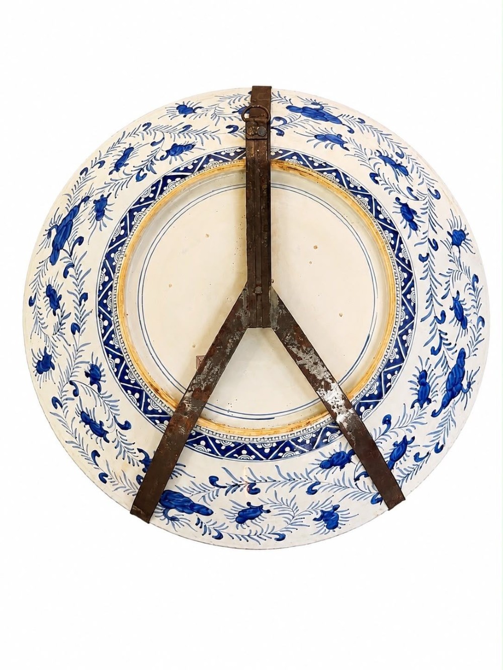 A large circular Japanese Imari porcelain charger decorated with a central blue and orange flower basket and geometric border. View VII