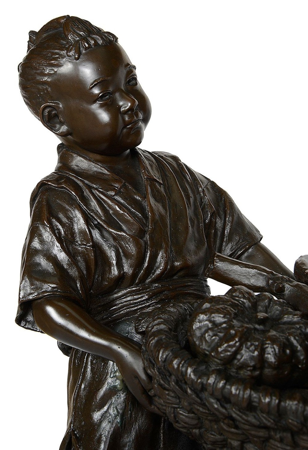 A dark brown patinated bronze sculpture depicting a Japanese woman and child carrying a woven basket filled with produce across a textured base. View III