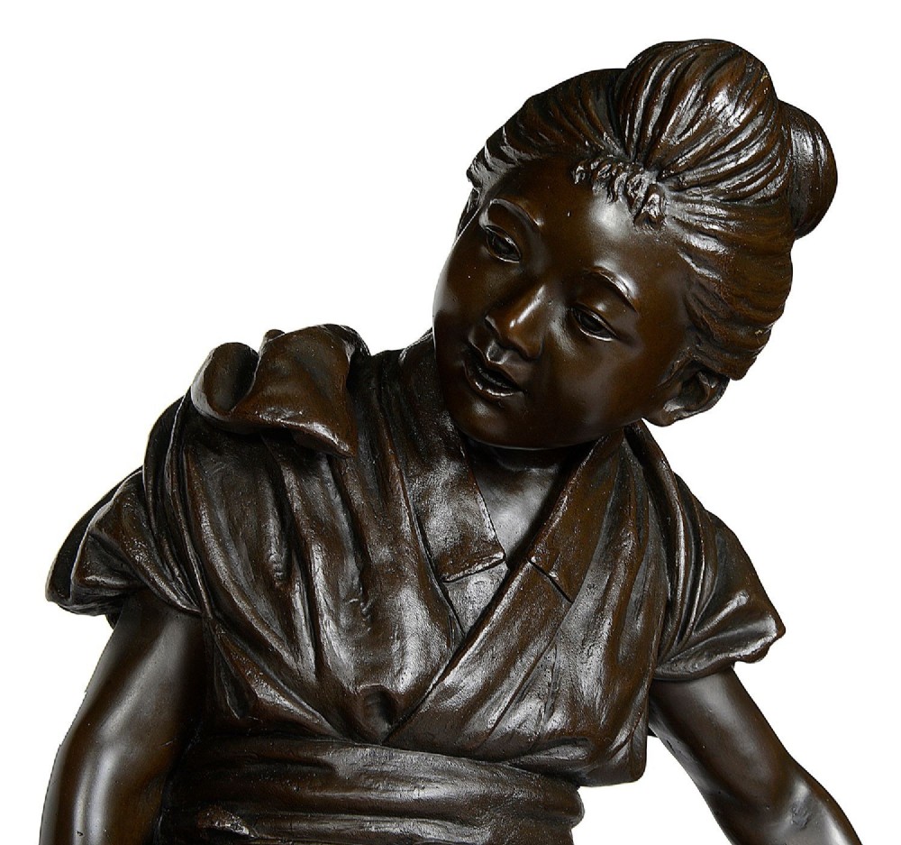 A dark brown patinated bronze sculpture depicting a Japanese woman and child carrying a woven basket filled with produce across a textured base. View IV