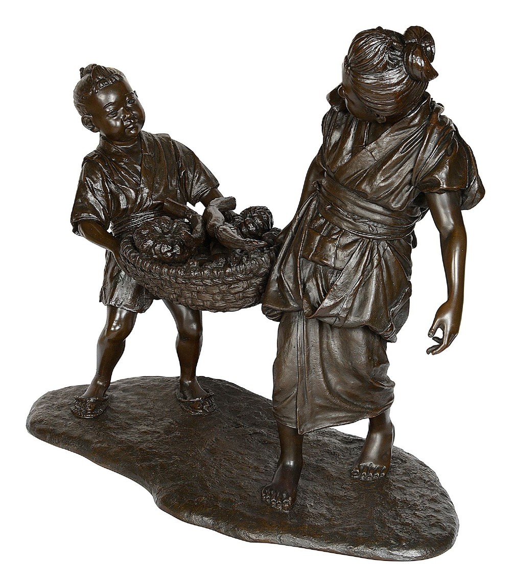 A dark brown patinated bronze sculpture depicting a Japanese woman and child carrying a woven basket filled with produce across a textured base. View V