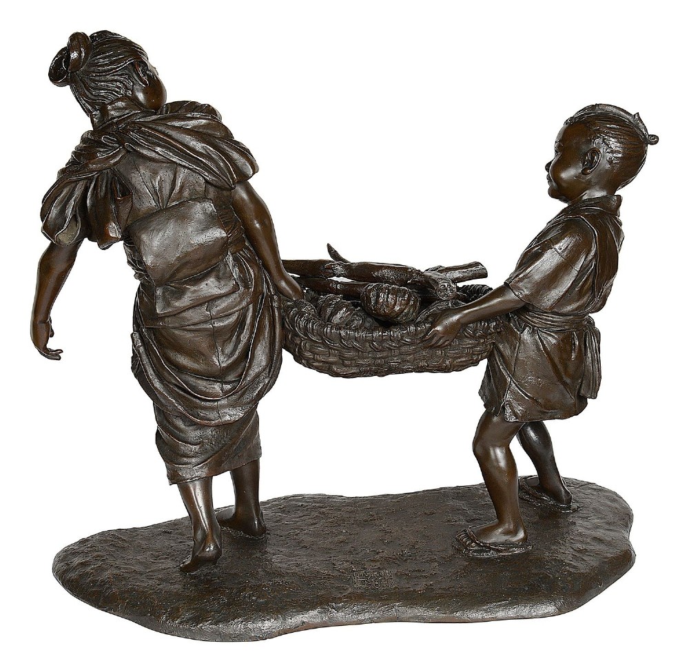 A dark brown patinated bronze sculpture depicting a Japanese woman and child carrying a woven basket filled with produce across a textured base. View VI