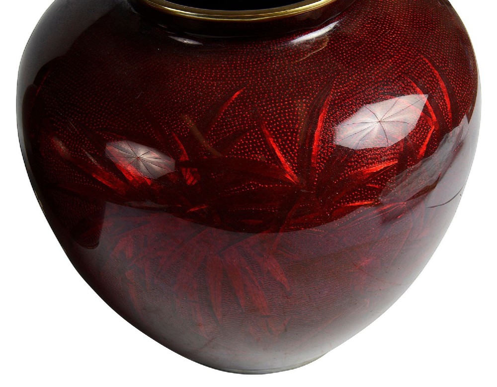 A pair of Japanese Meiji period baluster vases featuring translucent deep red enamel decorated with white blossom branches and small birds. View V