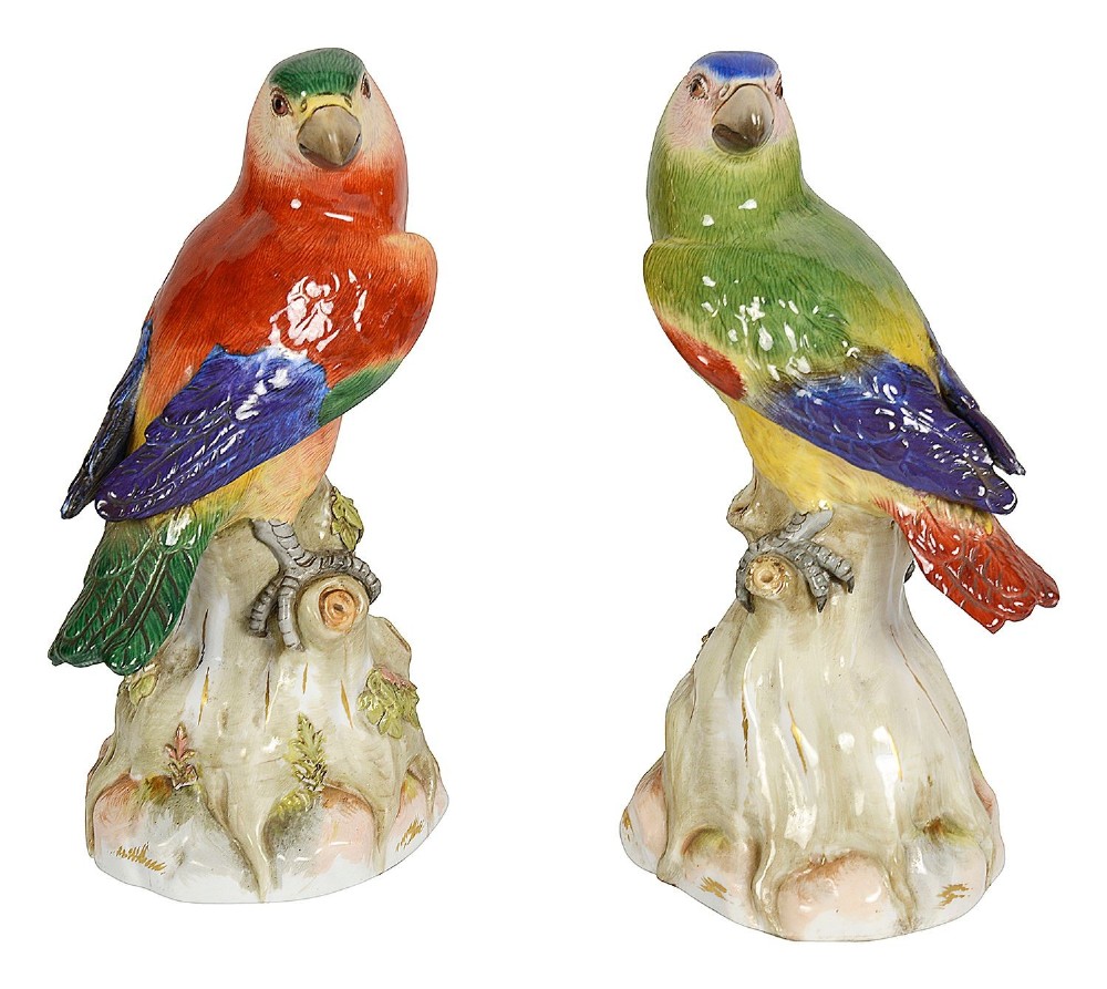 A pair of late 19th-century Meissen porcelain parrots with brightly coloured plumage perched on sculpted tree stump bases. View VII