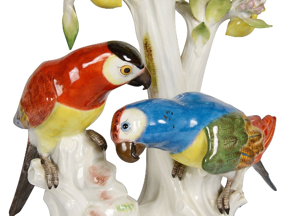 A 19th-century Meissen porcelain sculpture featuring two colourful parrots perched beneath a lemon tree with yellow fruit and green leaves. View II