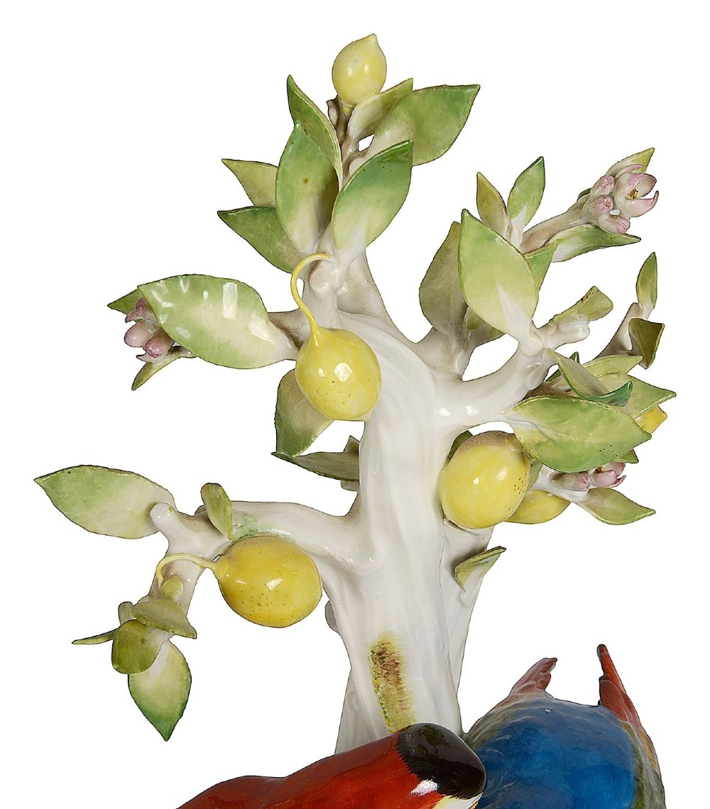 A 19th-century Meissen porcelain sculpture featuring two colourful parrots perched beneath a lemon tree with yellow fruit and green leaves. View VII
