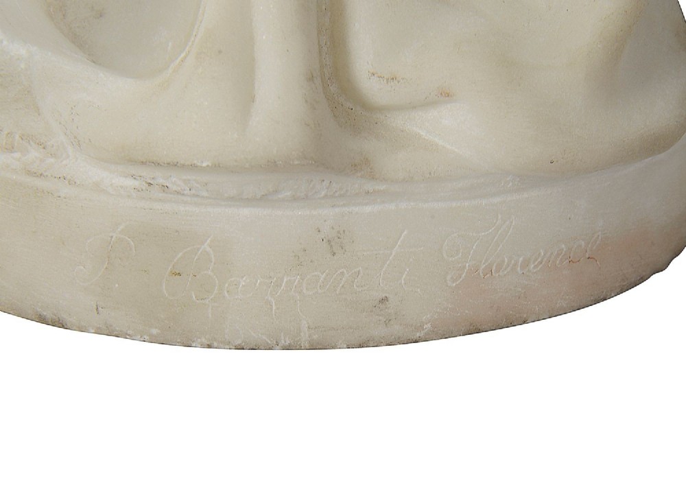 A 19th-century carved white marble sculpture depicting a standing young girl dressed in traditional draped garments and a patterned headscarf on an integrated base. View IV