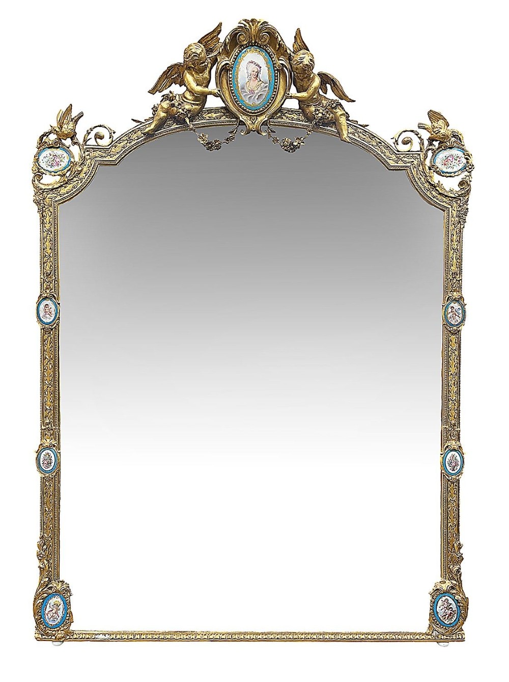 A large gilt-bronze wall mirror featuring an arched crest with sculpted putti, foliage mouldings, and oval Sevres porcelain plaques set along the frame.